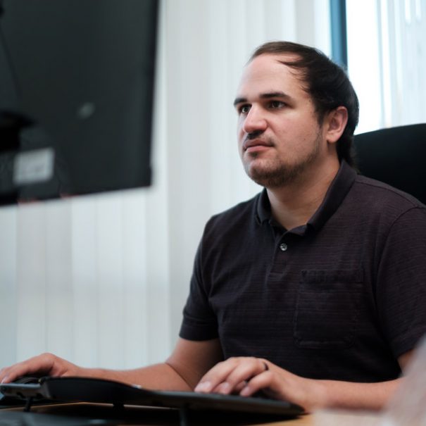 Enconnex employee working at a computer